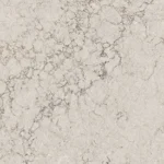 Caesarstone 6046 Moorland Fog surface in White and gray marble surface featuring natural, irregular veining patterns.